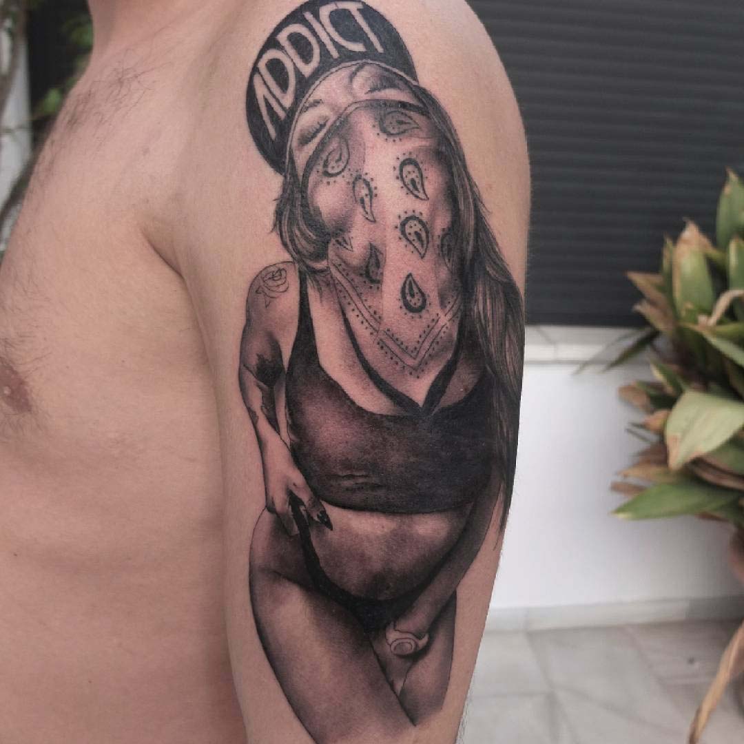 chicano girl tattoo on shoulder